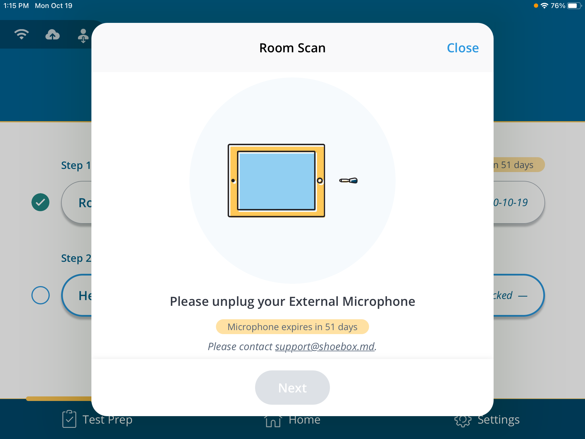 A screenshot of the prompt to unplug an external microphone for a room scan.