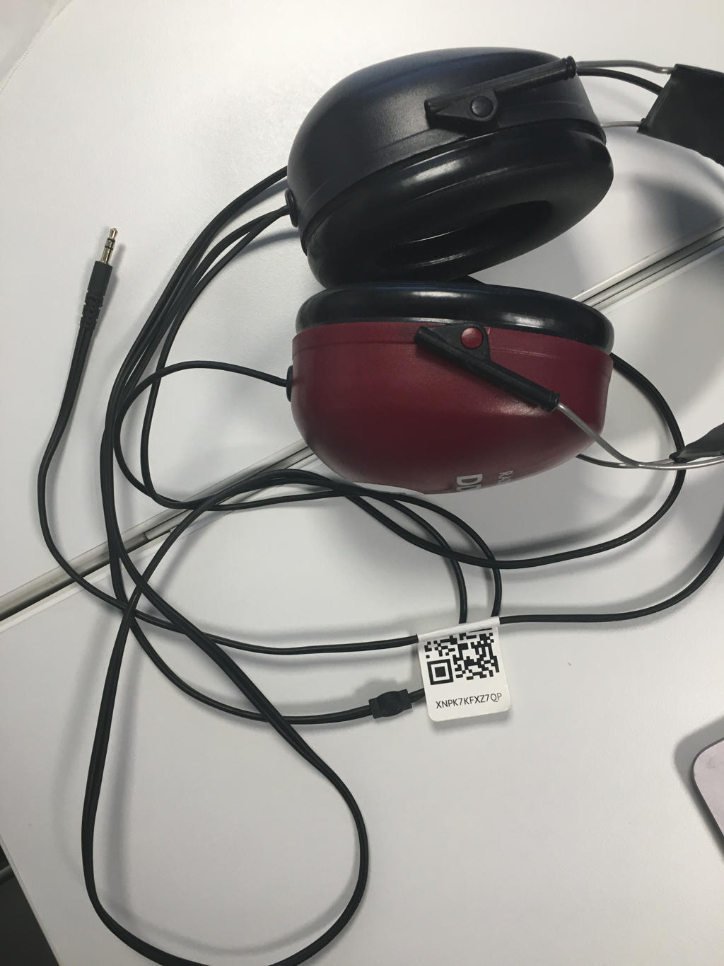 An image of DD450 headphones with the serial number sticker removed or damaged.
